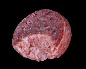 a piece of sausage on a black background