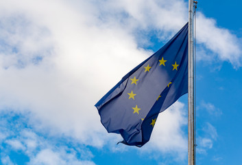 Europiean Union and Brexit, EU blue flag with yellow stars on blu sky sopy space