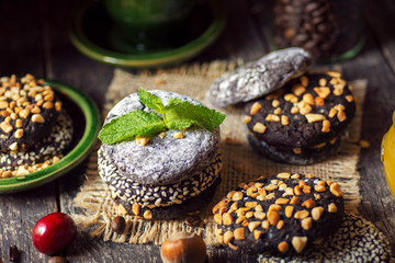 different types Brownie Cookies and table setting Sweet biscuits in dark. Homemade pastry 