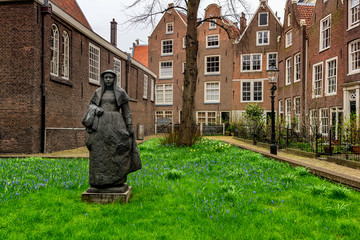 AMSTERDAM, NETHERLANDS - APRIL 9, 2018: Begijnhof is one of the oldest inner courts in the city of Amsterdam. A group of historic buildings, mostly private dwellings, centre on it.