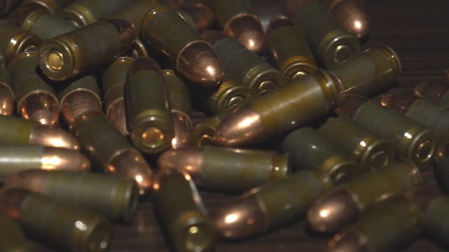Cartridges from the gun lie on a table. 4k