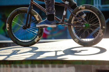 young guy with a sports bike is preparing to jump