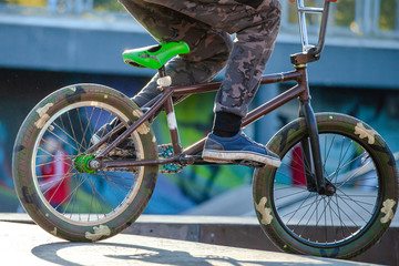young guy with a sports bike is preparing to jump