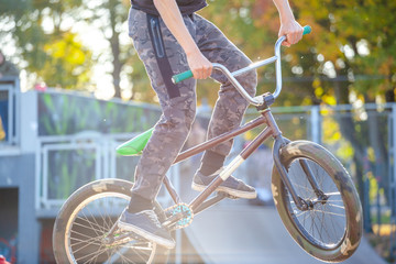 young athlete makes an extreme bike jump on a ramp