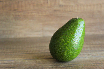 Avocados on a wooden table. Healthy food, diet. Cut avocado. copy space, copy space