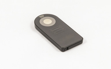 Small black unbranded remote control for DSLR camera