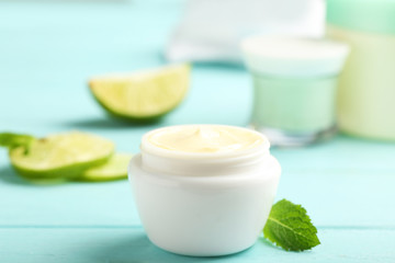 Obraz na płótnie Canvas Jar with cream on wooden background. Hand care cosmetics