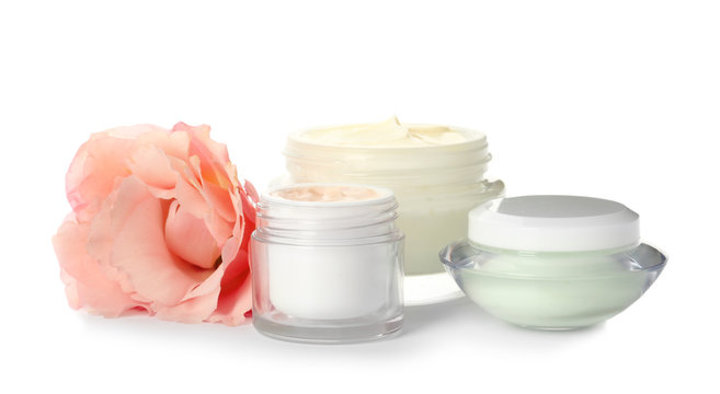 Jars with cream on white background. Hand care cosmetics