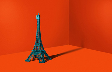 Figure of the Eiffel Tower in a heavy orange color. Travel concept, minimal style. An abstract theme, a modern approach to design.