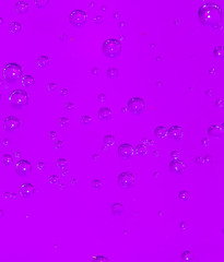 purple bubbles in water close-up abstract background