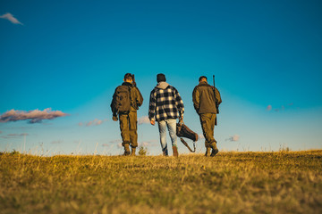 Hunters with shotgun gun on hunt. Closed and open hunting season. Track down.