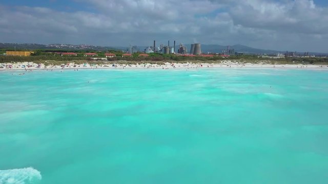 Aerial shot, incredibly beautiful calm sea with lots of clouds, white beach created because of huge water pollution with very calm sea, filmed with drone