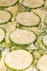 Oven cooked zucchini with melted Parmesan on top