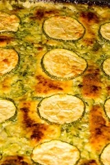Oven cooked zucchini with melted Parmesan on top