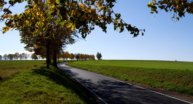 Ponitz / Germany: Winding country road in Eastern Thuringia on a sunny day in October