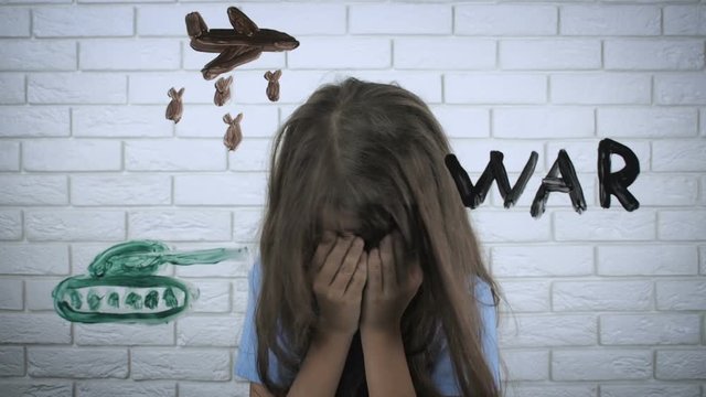 No war. Figure war. The child is crying, does not want war.