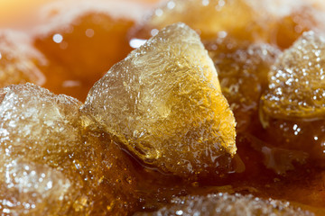 cola with ice cubes close up