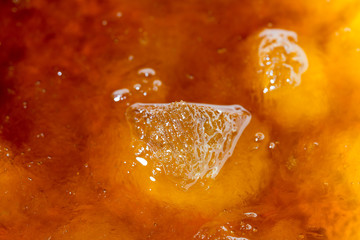 cola with ice cubes close up