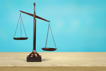 Law scales on table background