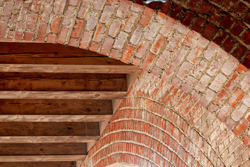 A brick structure with beefy wood ceiling joists.
