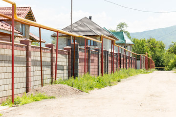 Fototapeta na wymiar gasified street and private houses
