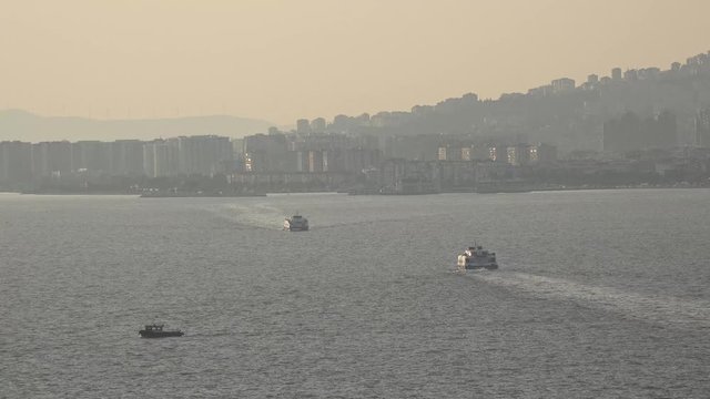 View of İzmir city, Turkey. Aegean city which is near Greece. Sea, buildings and ships in sunset time.