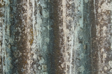 Gray wavy slate for the roof. Vertical view. Close-up. Background. Texture.