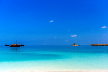 View of the paradise sandy beach with Dhoni boats, Maldives. Copy space for text.