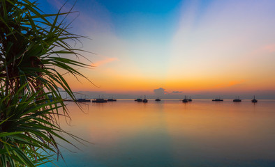 Dhoni boats on sunset background, Maldives. Copy space for text.