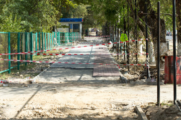 the curb, sidewalk, gravel, repair roads, repair of the surrounding grounds