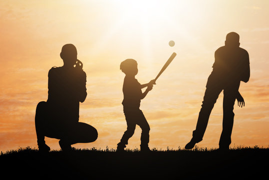 Silhouette Of Family Playing Baseball