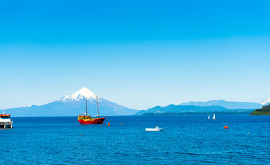 Obraz premium Osorno volcano and Llanquihue lake, Parque, Puerto Varas, Chile. Copy space for text