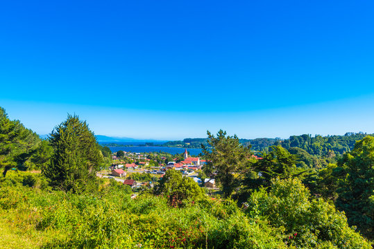View of the church on the background of the river, Puerto Octay, Chile. Copy space for text.