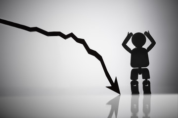 Human Figure Standing Besides Arrow Moving In Downward Direction