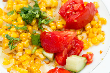 salad with corn, onion, cucumber and tomato