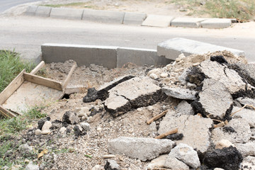 Fototapeta premium Background old cracked asphalt road scrap heap damage on the ground to be recycled.