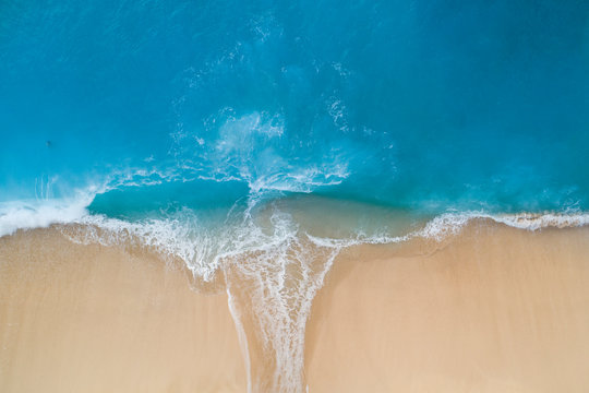 Aerial view of turquoise sea and sandy shore