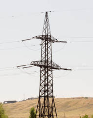 High-voltage transmission tower, blue sky background