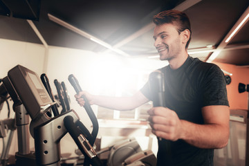 Sportsman Is Doing Exercises With Walking Trainer.