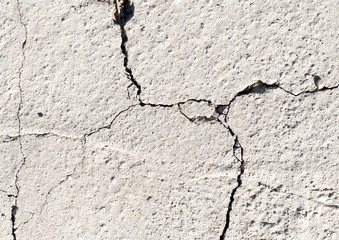 Cracked concrete texture closeup background
