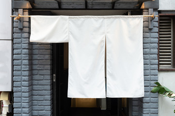 The curtain-like fabric that hangs in front of traditional Japanese restaurants and shops not only serves as a signboard, but holds a larger meaning,