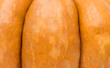 Part of orange pumpkin, natural background