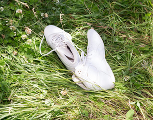 white female shoes on grass