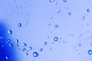 water drops on blue glass