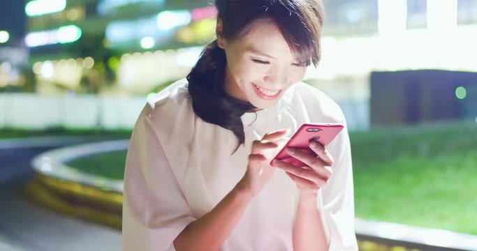 woman use phone happily