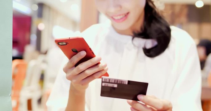 woman use phone and card