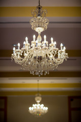 lighting lamp hanging on ceiling of ballroom dance in wedding ceremony date. Retro and vintage style.