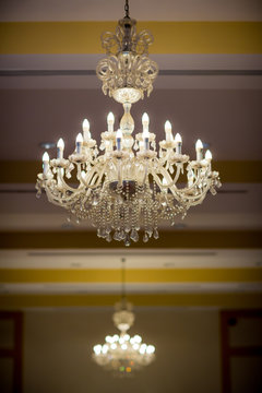 lighting lamp hanging on ceiling of ballroom dance in wedding ceremony date. Retro and vintage style.