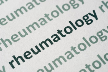 Fototapeta premium word rheumatology printed on paper macro