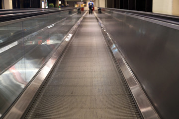 Moving sidewalk people transporter in airport